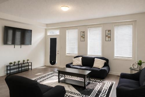 Cambridge House | 2024 Built 3-Bedroom Cambridge Townhome with Free Parking, WiFi, Full Kitchen, Laundry & Foosball - 8 Mins to African Lion Safari - Great for Families, Groups & Work Stays!