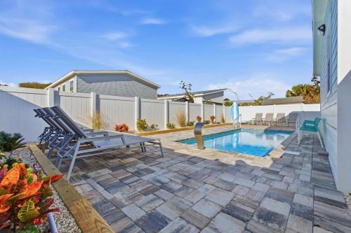 Palm Coast House | 4BR Coastal Pool Cottage Golf Cart Kayaks