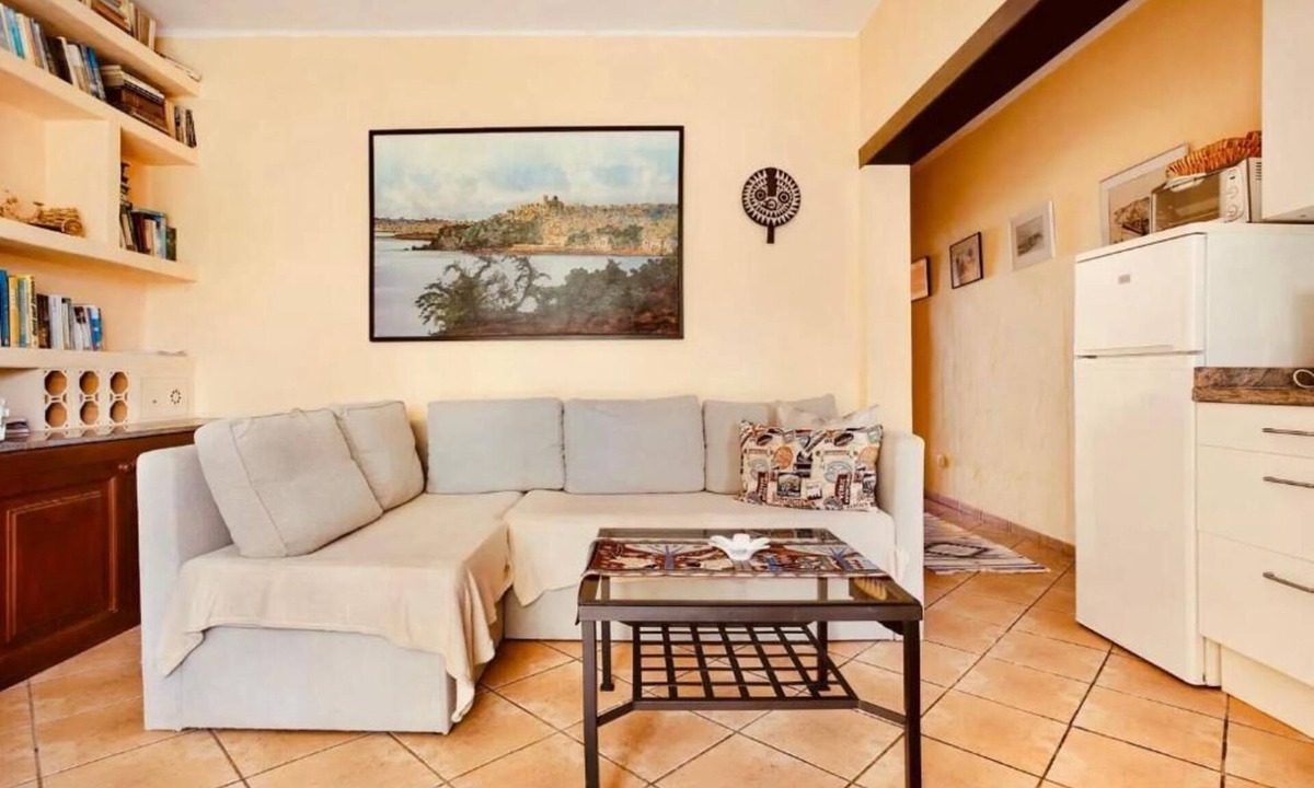 Teguise Apartment | Apartment 1 with panoramic window in the bedroom facing the sea and Risco Famara