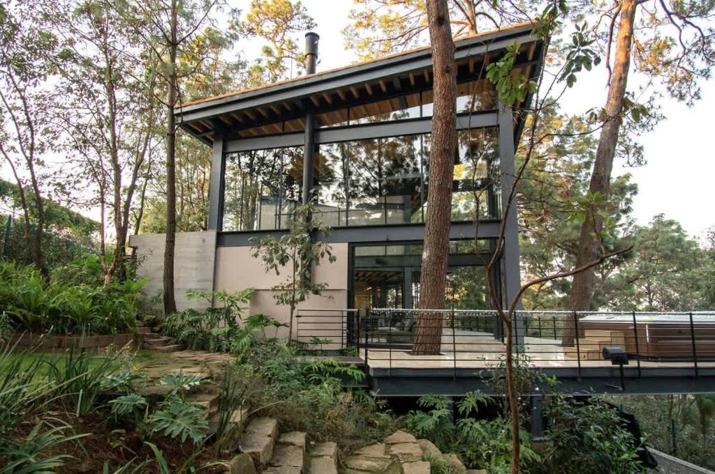 Valle de Bravo House | Architectural glass masterpiece villa in Avandaro Forest