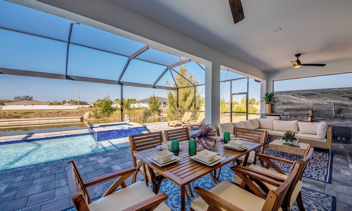 Pelican Villa | Awesome 4 BR/3 bath waterfront villa w. heated pool, hot tub, kayaks, fishing poles, bikes