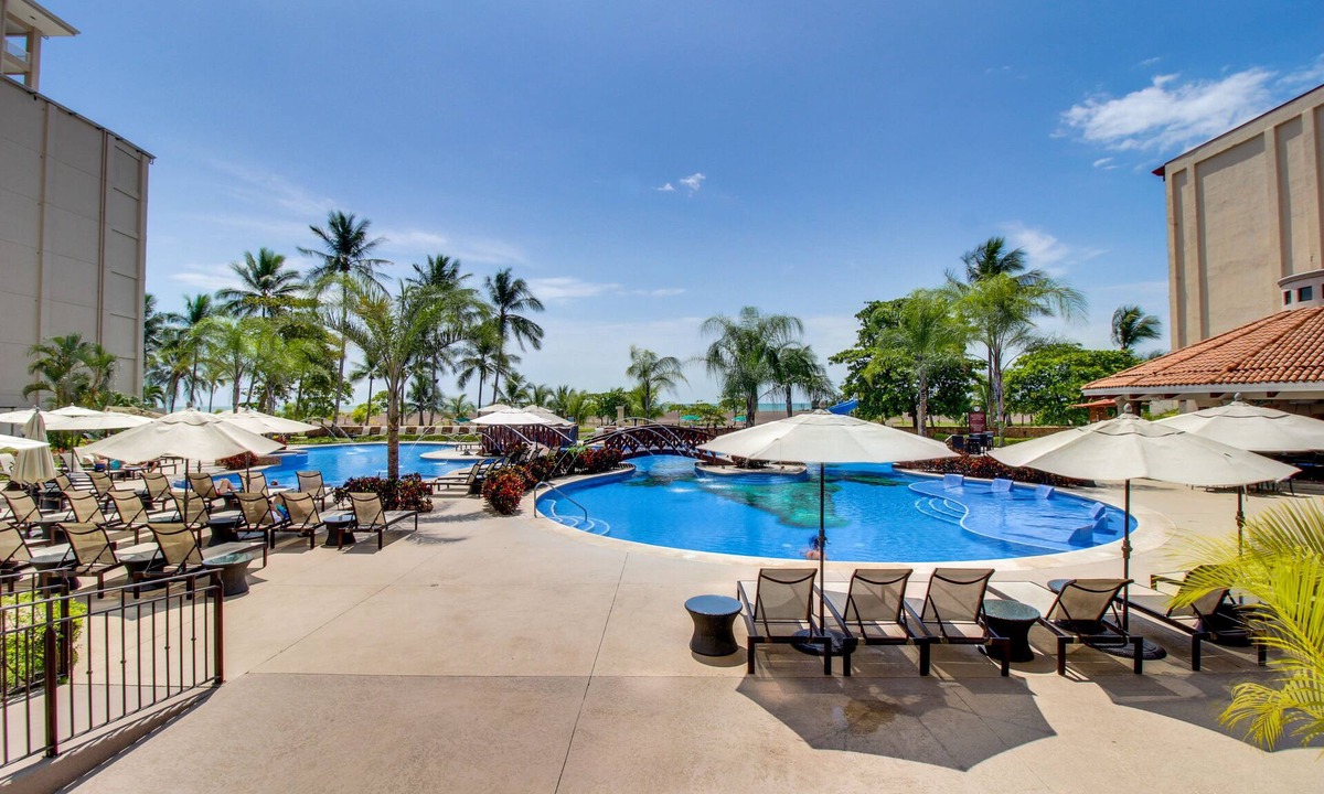 Barrio Los Villalobos Apartment | Beachfront Condo with Resort Pools and Gardens, and Ocean-View Balcony