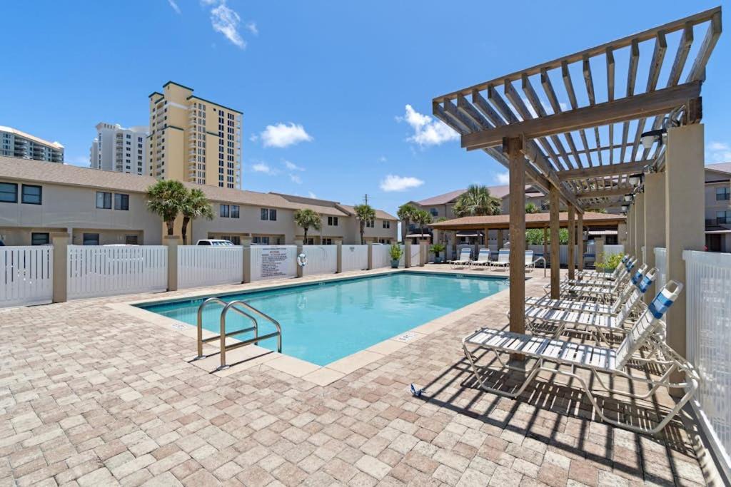 Sugar Beach House | Beachfront townhome with on-site beach access heated pool patio grill AC WD