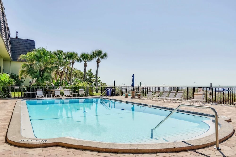Indian Rocks Beach Apartment | Beachfront condo with a view of the water, a pool, a sundeck, a private balcony, and a washer and dryer
