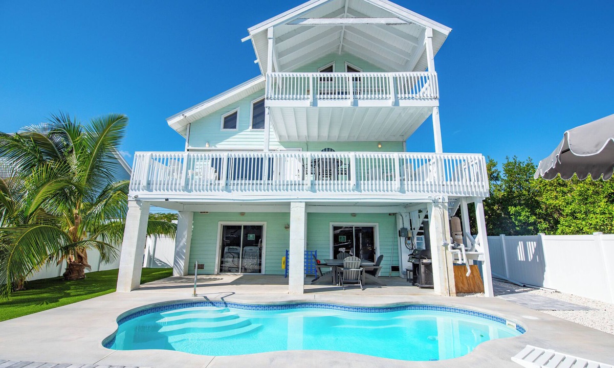 Cutthroat Harbor Estates House | Beautiful 3BR/3BA Canal Home with Pool, Modern Upgrades, Dock for 28' Boat, Fenced Backyard
