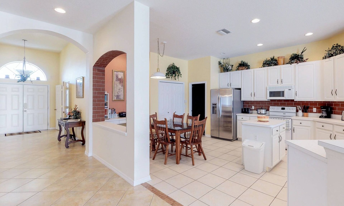 Sabal Harbour House | Beautiful Waterside Home with a Private Pool, Spa, and Lake Views
