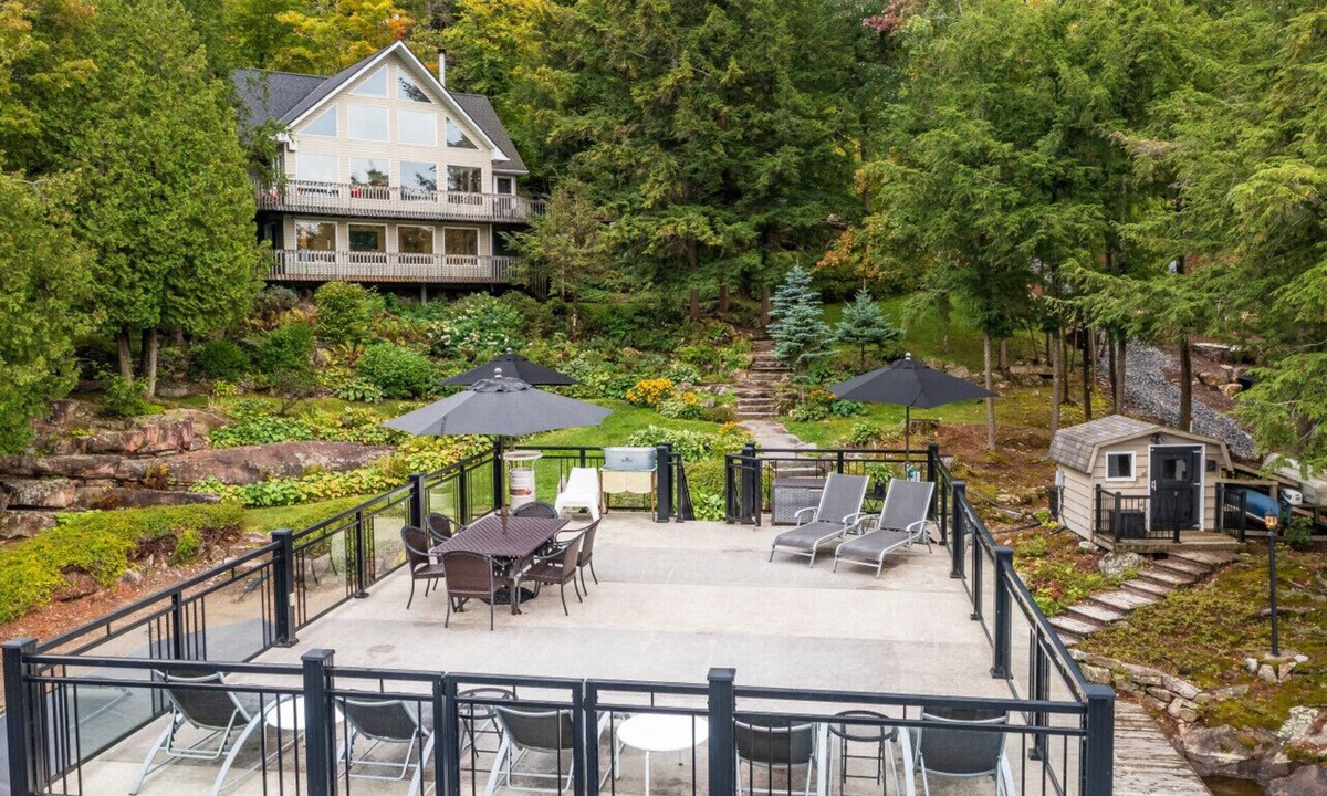 Windermere Cottage | Beautifully landscaped with a sandy beach, outdoor sauna, hot-tub and ample water toys.