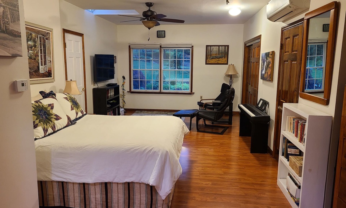 Redding Ridge Apartment | Bedroom, bathroom with beautiful shower, second room with work or eating area.