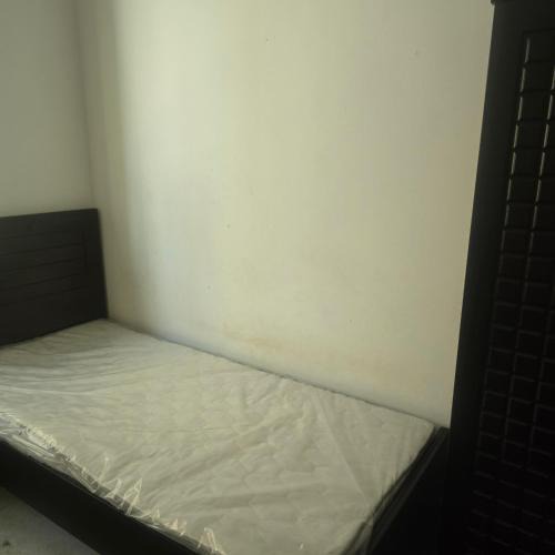 Sharjah Apartment | Bedroom with shared kitchen men only