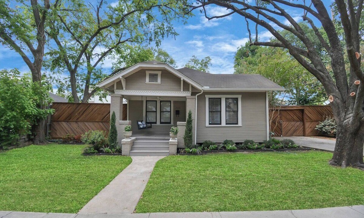 Greater Heights House | Beverly is a charming 1925 cottage-style bungalow in The Heights, sleeping 4 (2B/1B) and filled with natural light. Walk to the jog track, tennis courts, and local shops/eateries. Enjoy a fenced, pet-friendly yard, front porch swing, and a relaxing b