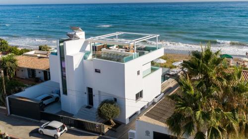 Urbanizacion Costabella Villa | Breath Taking Front Line Beach Villa with Sauna & Jacuzzi