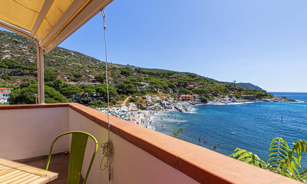 Seccheto Apartment | Camilla, a two-room apartment in Seccheto with a splendid sea view, a small balcony equipped with ch