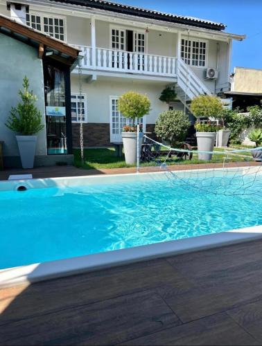 Jardim Iate Clube House | Casa com piscina Aquecida Balneário Camboriú CasaAlbertiBc
