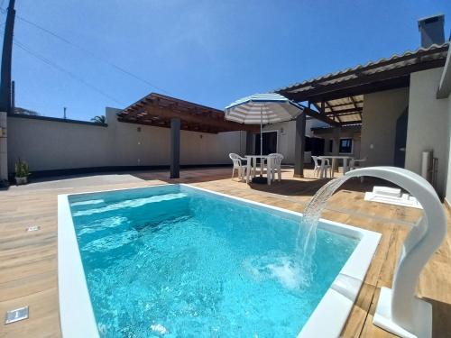 Capao da Canoa House | Casa com piscina, Ar condicionado, Pertinho Do Mar Em Capão Da Canoa