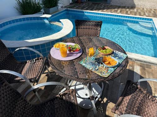 Jardim Casablanca House | Casa em Peruíbe, Piscina, Hidro, Ar condicionado, Churrasqueira