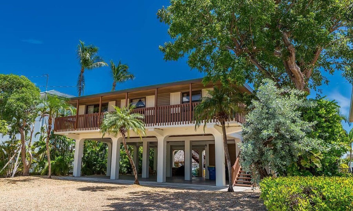 Venetian Shores House | Charming 3BR canal home in Plantation Key, perfect for family getaways.
