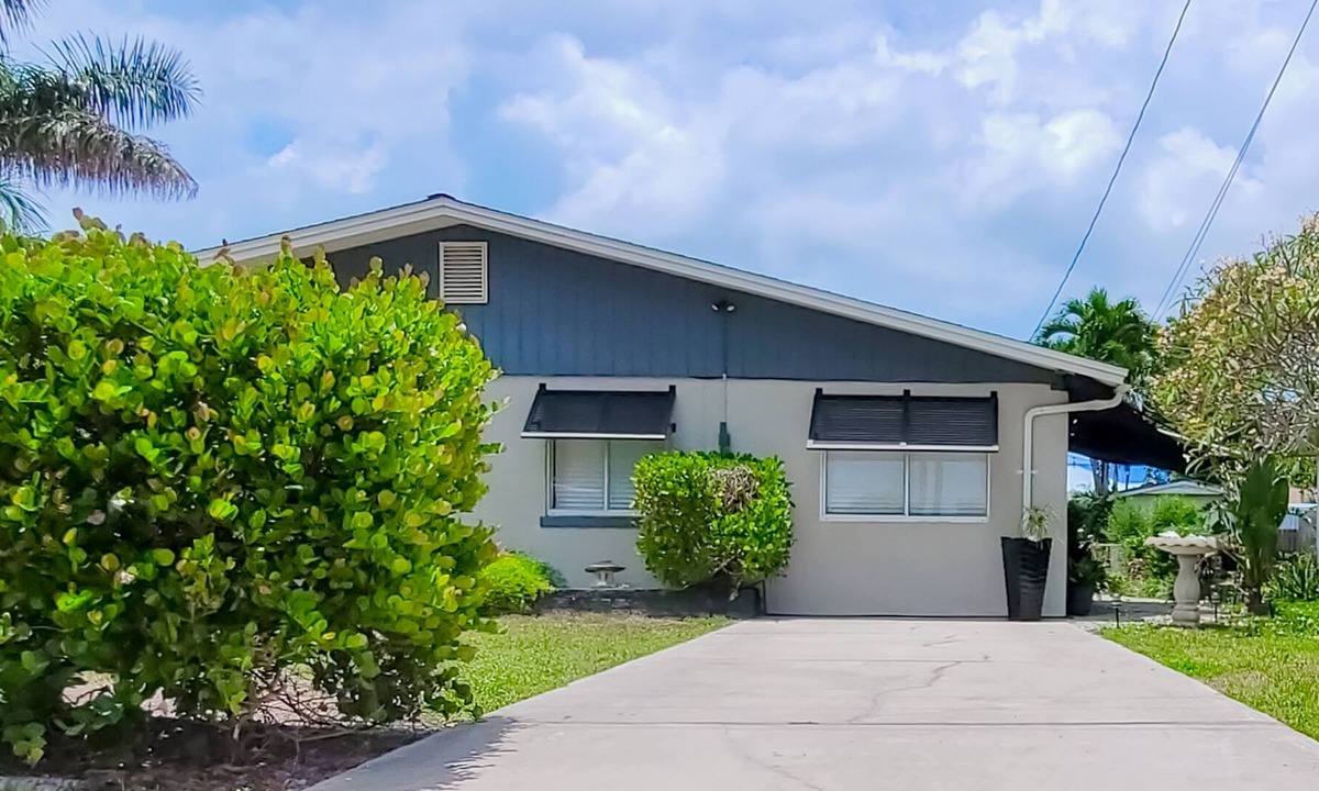 Isles of Capri House | Charming home with inviting patio, W/D, central AC & grill