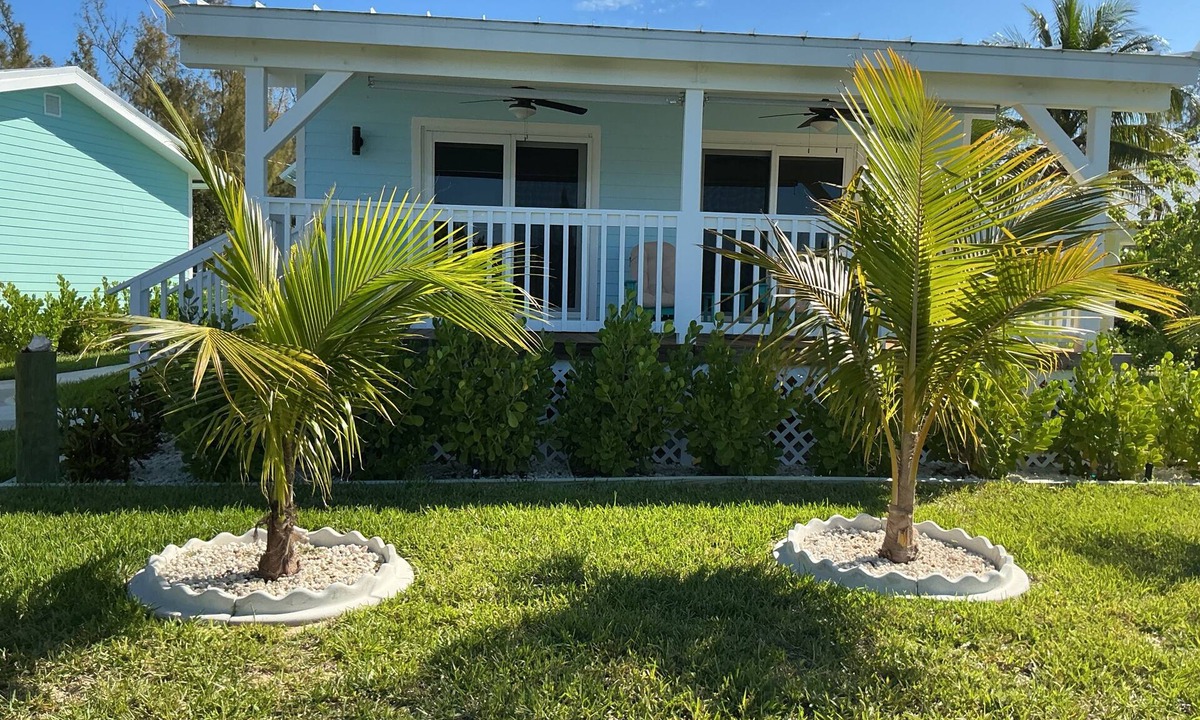 Bahama Reef Apartment | Charming New Blue Studio on water with dock, WiFi & AC in fun time Freeport