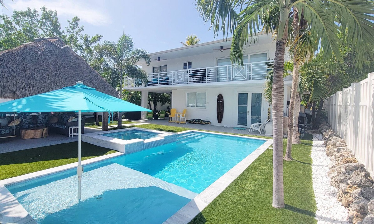 Tavernier House | Coconut Hut Oasis - 3 Bedroom Waterfront home with Pool/Spa, Tiki Hut, and Dock
