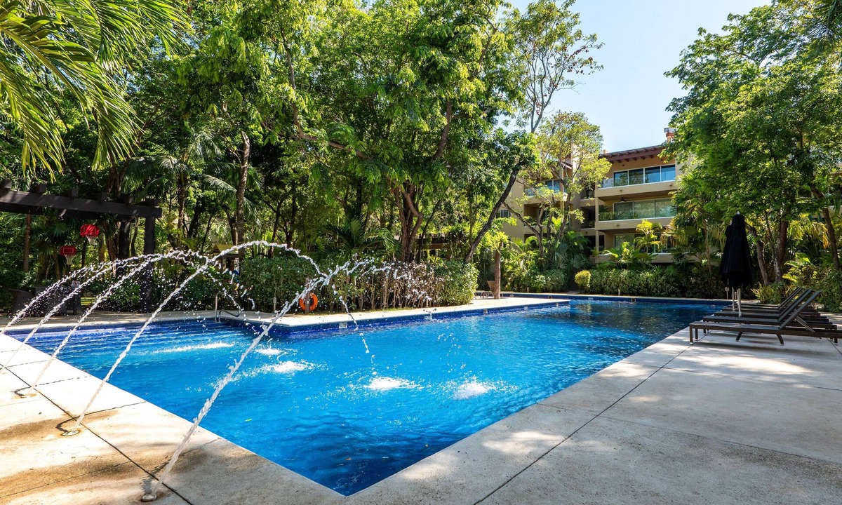 Playacar Fase II Condo | Comfortable family condo with rooftop jetted hot tub, pool & full kitchen