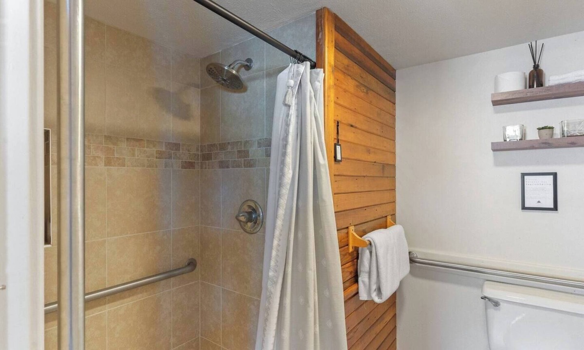 Clark Bed & Breakfast | Comfortable private queen room in the True North Adventure Lodge. Includes a queen bed, private ensuite bathroom, and access to shared amenities like the kitchen, great room, and hot tub. Great for couples or solo travelers.