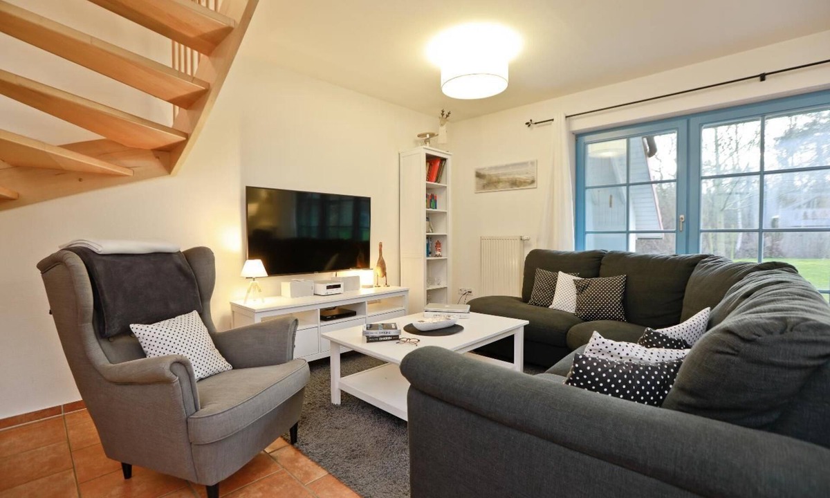 Zingst Apartment | Comfortable semi-detached house with terrace, garden view and pool in Zingst -
