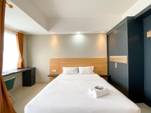 Duren Sawit Apartment | Comfy Studio at Gateway Park LRT City Jatibening Apartment By Travelio
