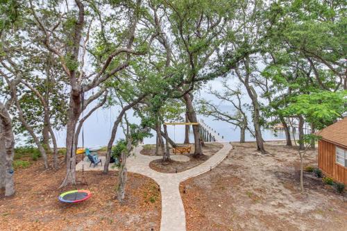 Gulf Breeze Apartment | Cozy Bayfront Log Cabin! Fishing Pier, Swim Dock!
