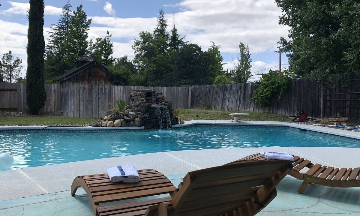 Redding House | Cozy mid century house with pool, hot tub, Dish Tv, WiFi, fireplace, waterfall