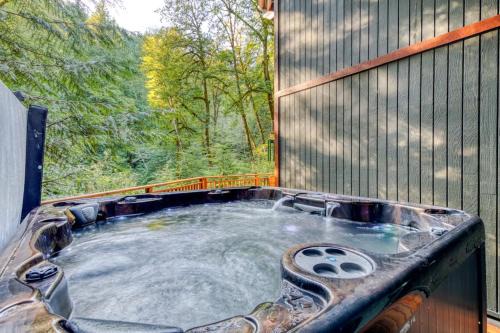 Rhododendron House | Creekside home with hot tub deck & great woodland views