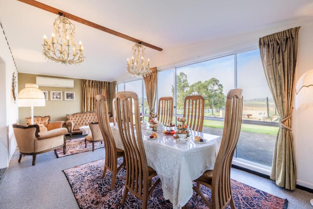 Woodville House | Dei Gratia High Tea House, 11A Loch Goyle Dr, Woodville - a quirky retreat with linen, aircon and Wi-Fi