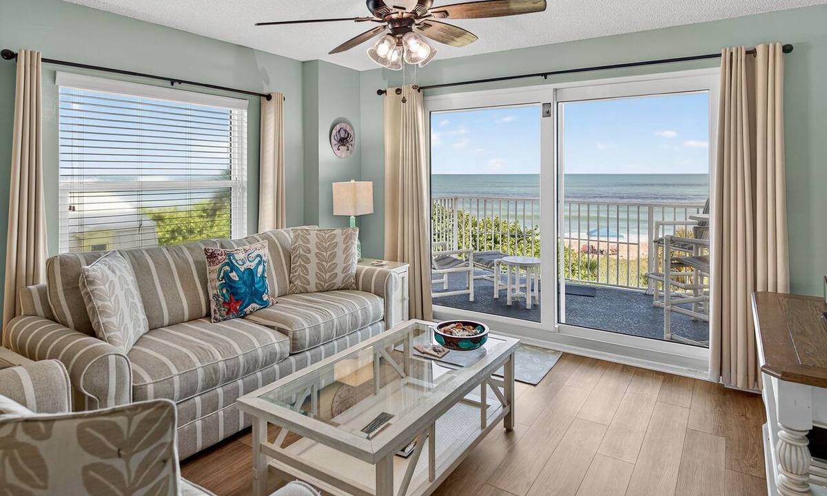 Seawinds Condo Condo | Direct oceanfront 2/2 corner condo with large balcony, heated pool, and garage parking