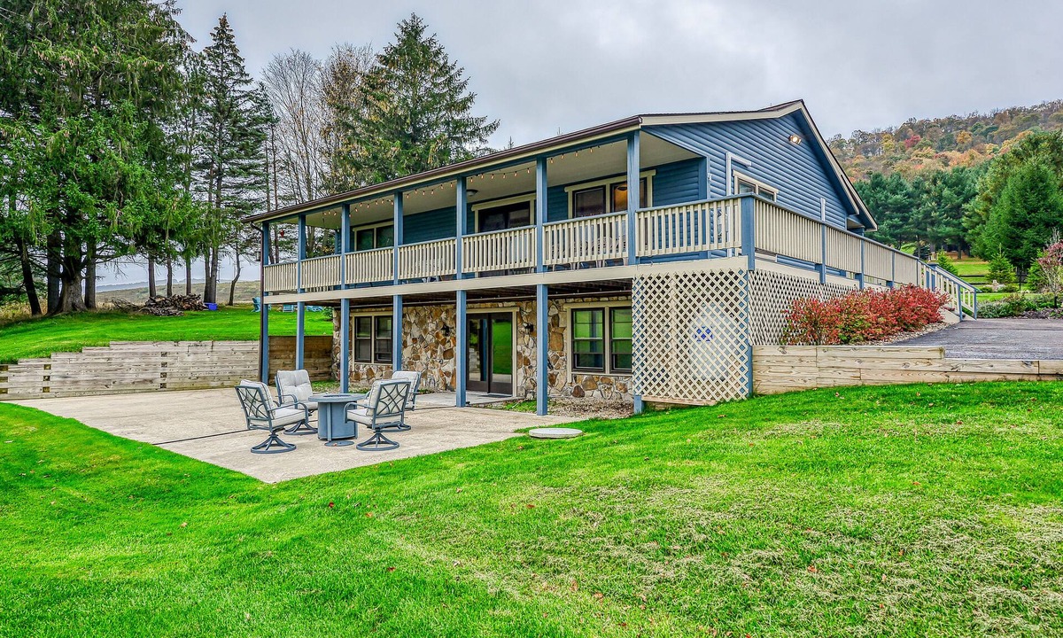McHenry Cabin | Dog-friendly home with private pond, wraparound porch & fireplaces