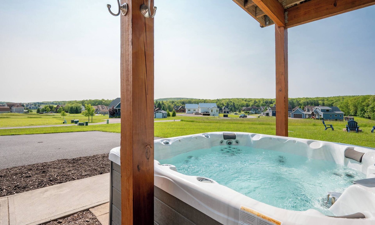 Waterfront Greens House | Dog Friendly Lake Escape w/Dock Slip & Hot Tub