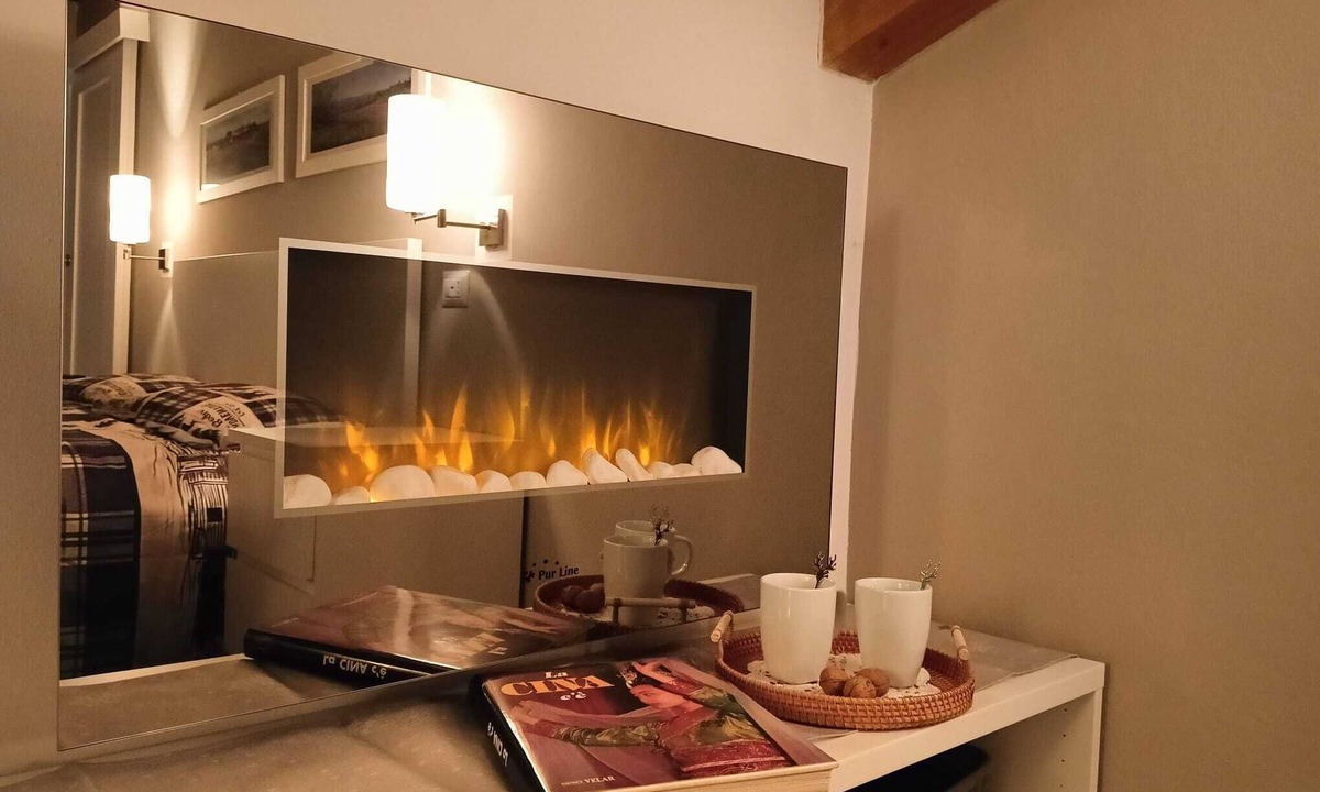 Levico Terme Apartment | Elegant attic with Dolomites view, relaxation and nature in Levico Terme.