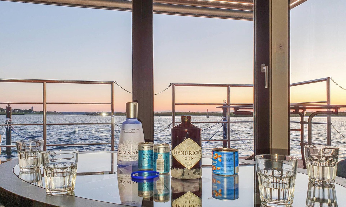 Lelystad Boat Rental | Enjoy a vacation on the water in this inviting houseboat in Lelystad.