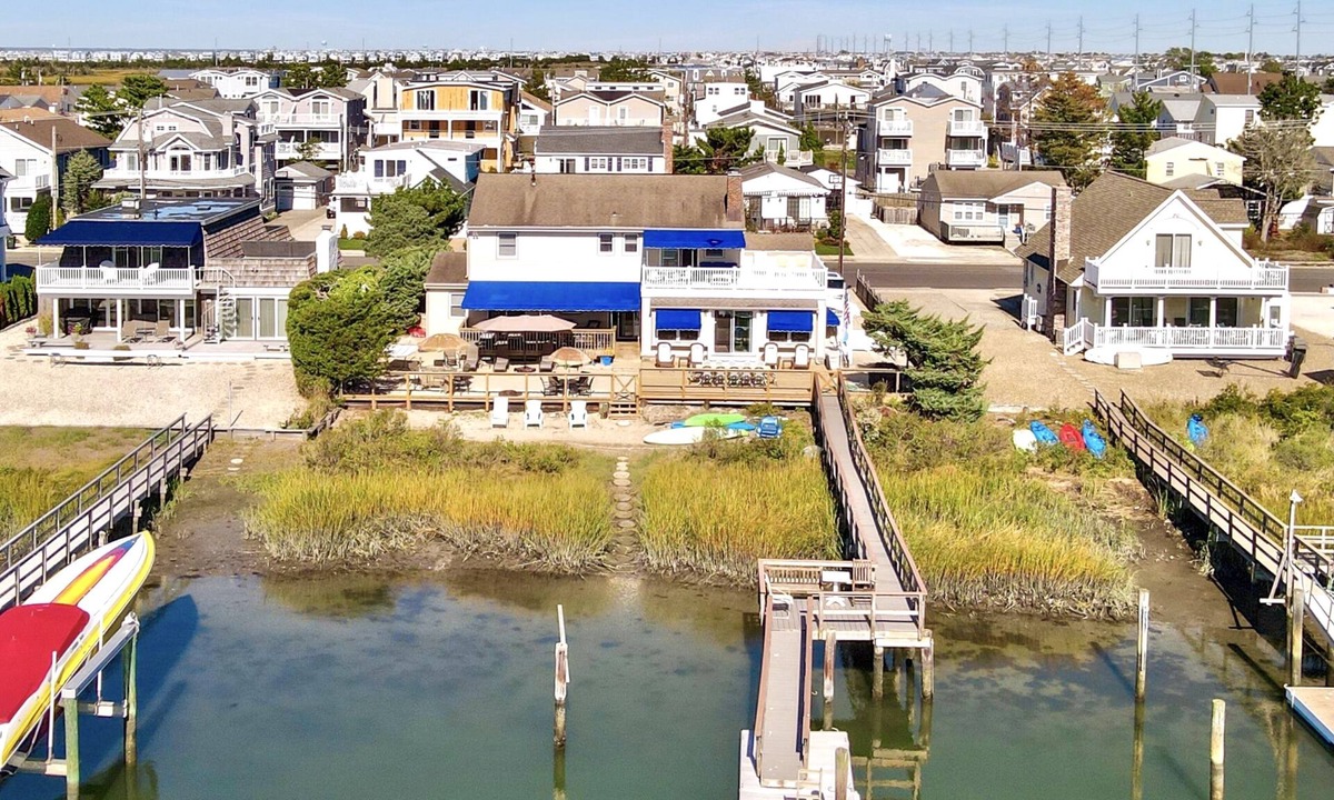 Avalon House | ENJOY BAY VIEWS! Bayfront home, shady front porch 2 boat docking areas, gameroom to watch TV, A short bike ride or walk to Avalon's fine business district for ice cream, dining, mini golf, shopping and more.