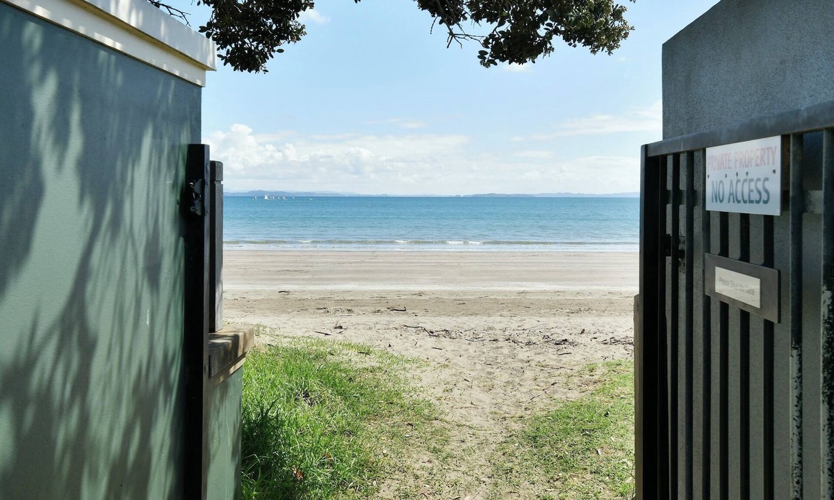 Manly House | Experience a Kiwi beach holiday here, a couple of minutes walk to the sand .