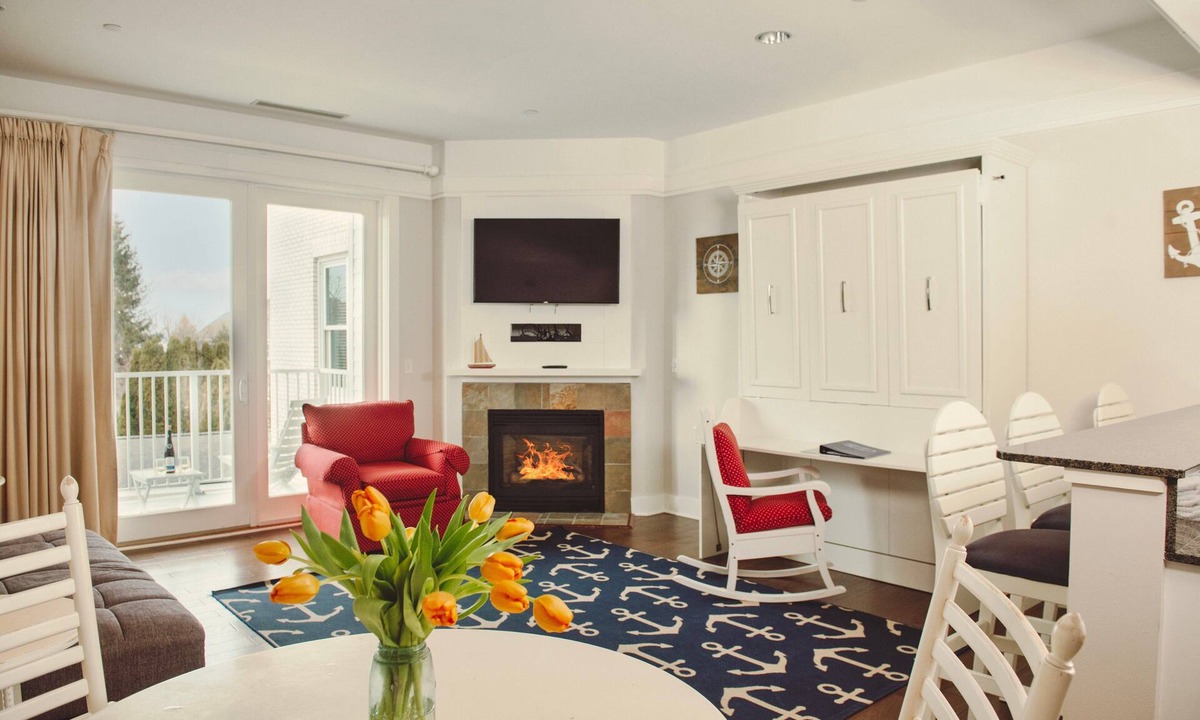 Bay Harbor Condo | Experience luxury at Captain Suite 219 in Bay Harbor, MI, featuring a cozy bedroom and village view.