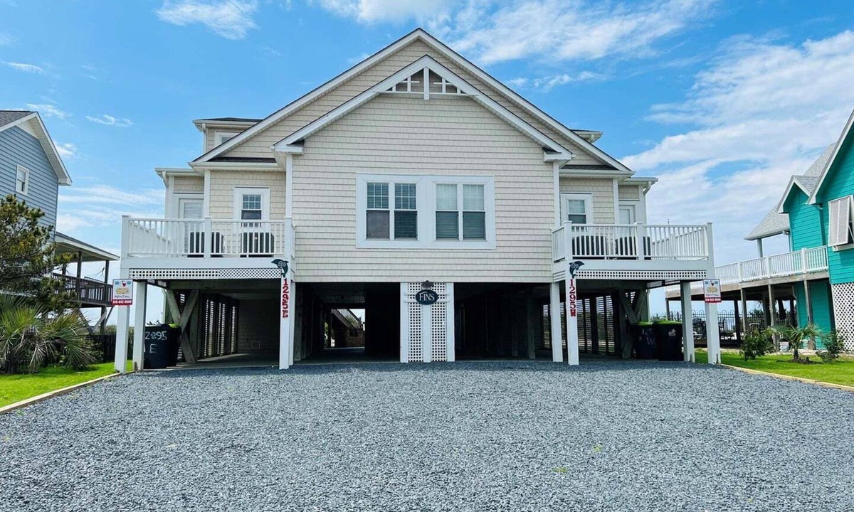 Holden Beach House | Experience oceanfront luxury at FINS, a spacious 10-bedroom retreat in Holden Beach.
