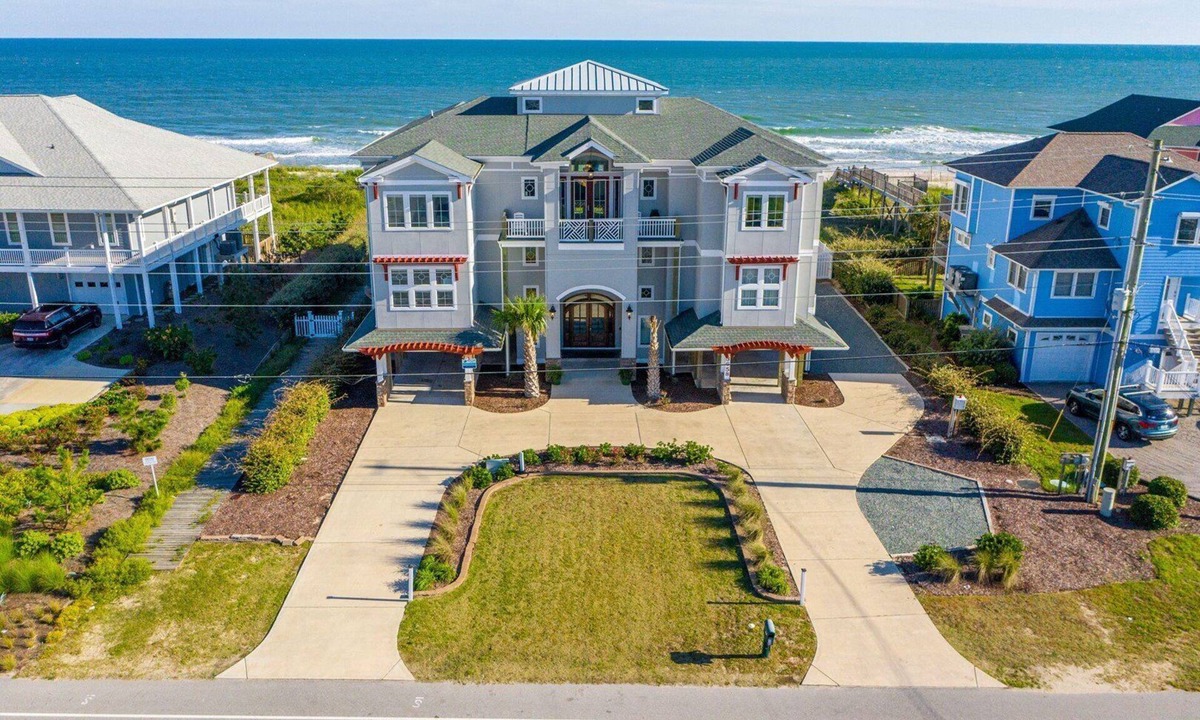 North Topsail Beach House | Experience oceanfront luxury at Topsail Manor, a spacious 8-bedroom paradise in North Topsail Beach.