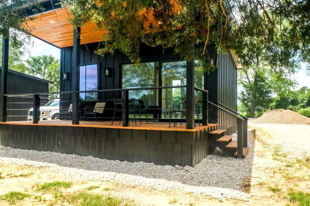 Waller Cabin | Family-Friendly Tiny Home Resort with Pool, Goats & Pond in Hempstead near Houston
