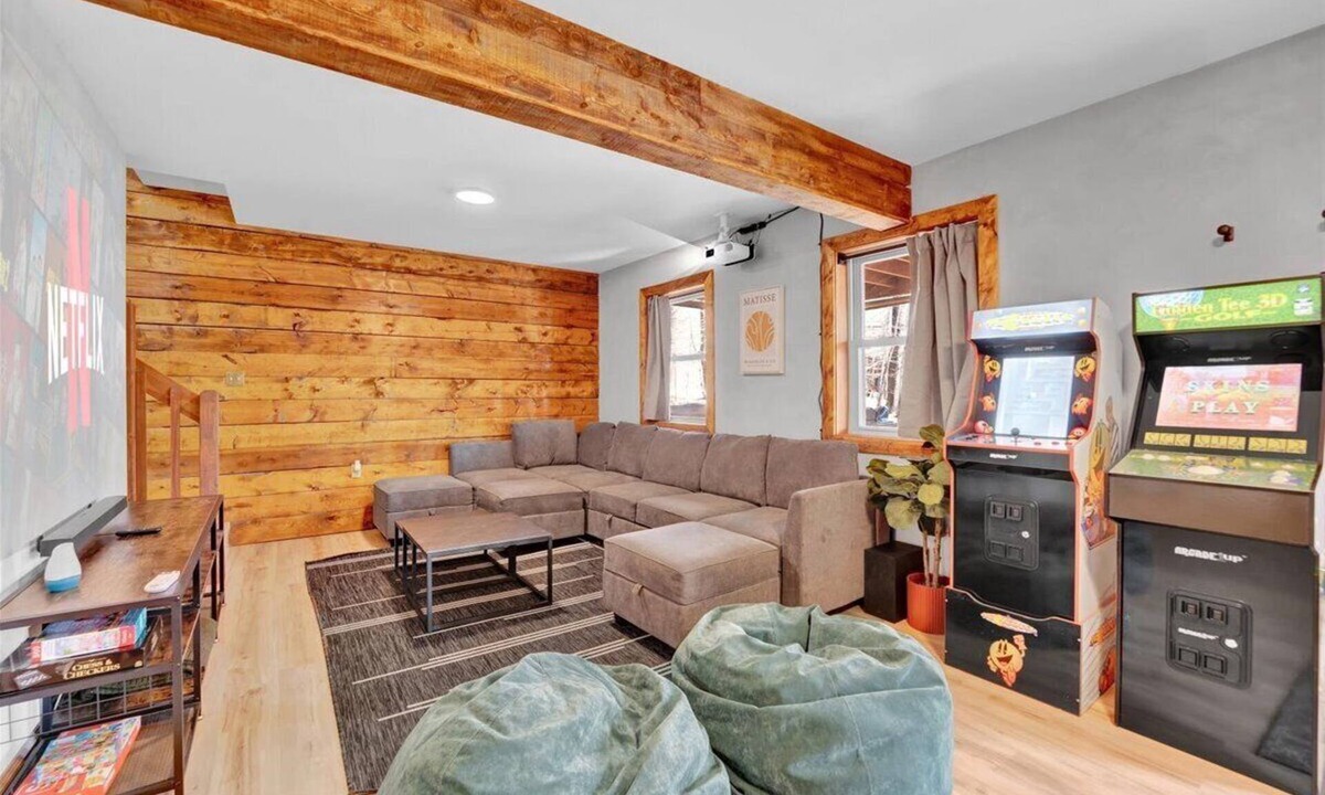 Gouldsboro Ski Chalet | FUN-FILLED A-Frame Chalet in the resort-like Big Bass Lake Community in the Poconos! ⊹ Movie Theater ⊹ Arcade Room ⊹ Hot Tub ⊹ Mini Golf ⊹ Indoor Fireplace ⊹ Outdoor Fire Pit