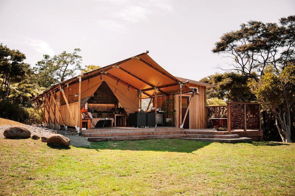 Waitakere RV Rental | Glamping in Waitakere in this Luxury Safari Tent Rental, for the Best Vacations in New Zealand