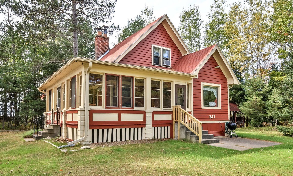 St Germain House | Gorgeous lakefront cabin, wrap-around enclosed porch, dock!