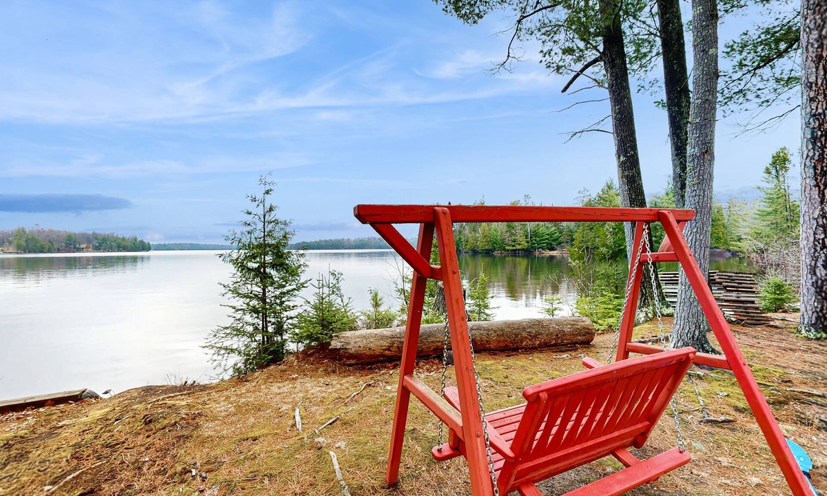 Three Lakes House | Gorgeous lakefront lodge with dock, deck, game room & firepit