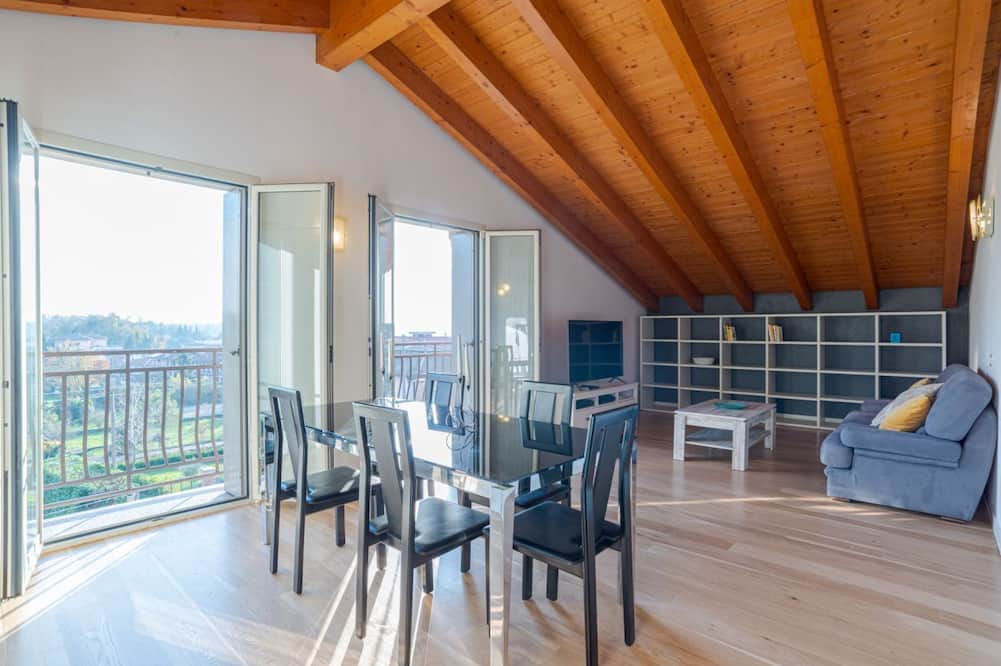 Cesana Brianza Apartment | GuestHost - Travel with your family and friends and explore lakes and mountains near Como!This large attic, with two bedrooms, two bathrooms, open space kitchen with island, large living room, terraces and patio for relaxing, is located on the road that