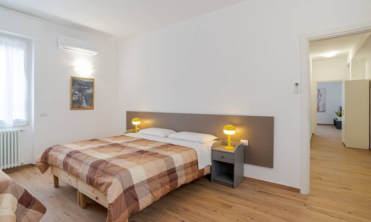 Cesana Brianza Apartment | GuestHost - Travel with your family and friends and explore lakes and mountains near Como!This spacious apartment, with two bedrooms, two bathrooms, open space kitchen with island, large living room, small terrace, is located on the road that connects th