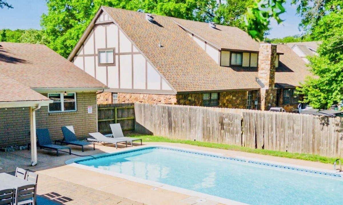 South Tulsa House | Heart of Tulsa, game room, fireplace, Sleeps 8, grill, pool.