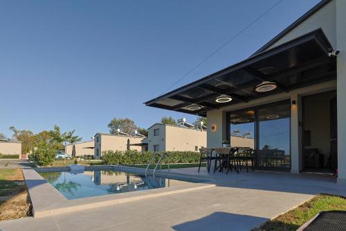 Olymbiaki Akti Villa | HELIOS - Seaside Pool Villa & Private Parking